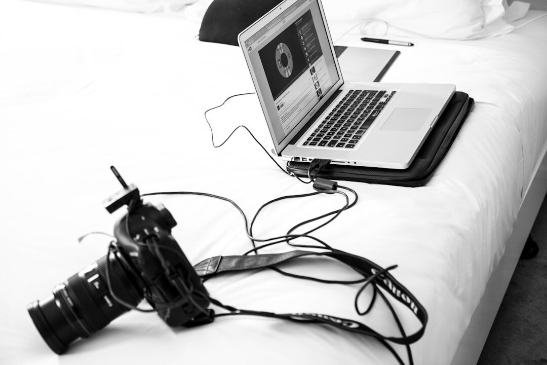 Multimedia journalist with camera and laptop for full multimedia report production